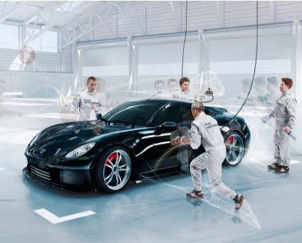 A picture of car experts working on a car